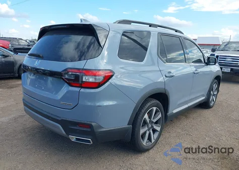 2023 Honda Pilot 2Wd Touring z USA, uszkodzony, nr VIN 5FNYG2H7XPB014642